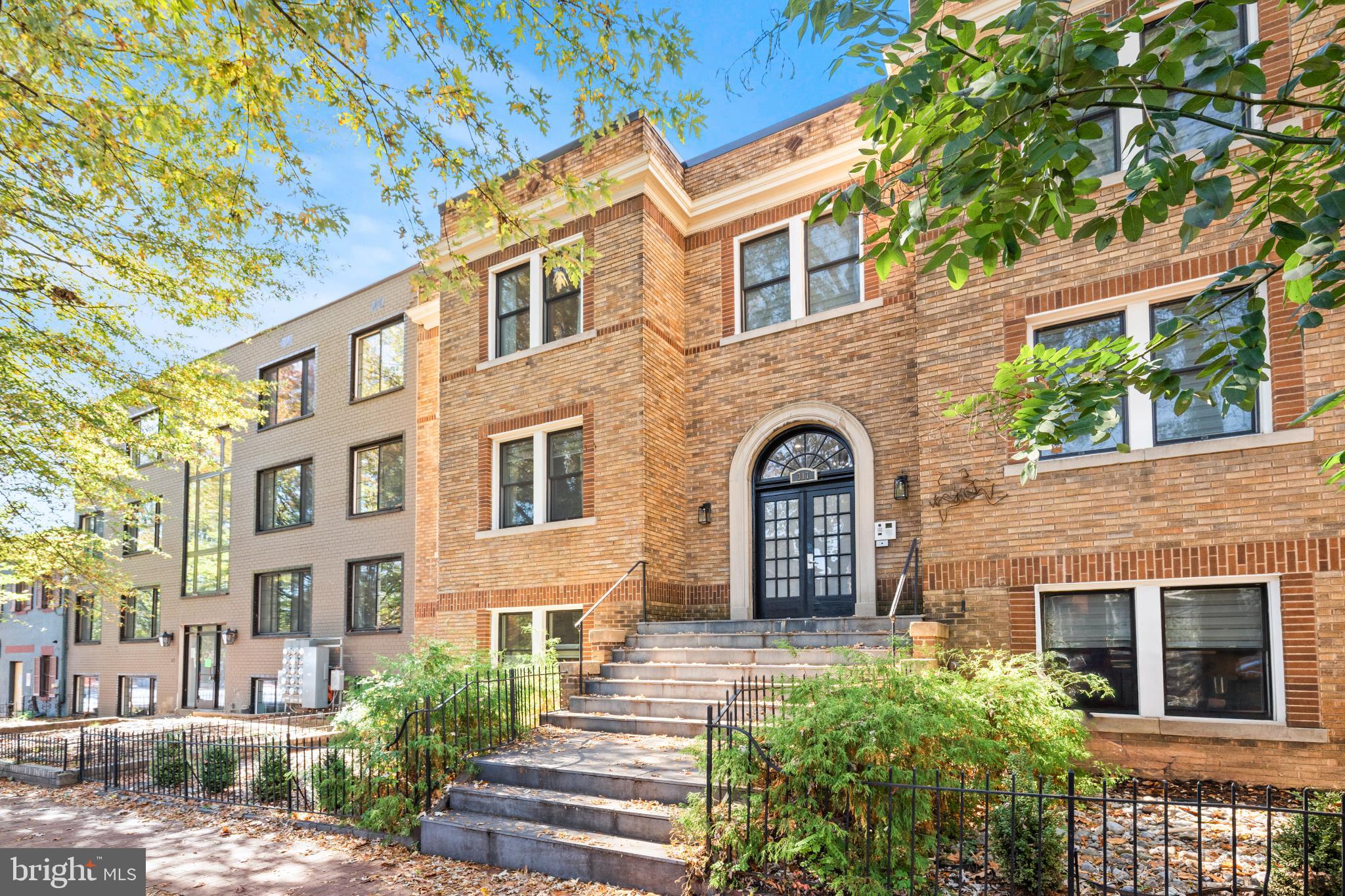 317 3rd Street Southeast, Unit 33 Washington, DC 20003 - Photo 2 of 26 a front view of a building with a garden