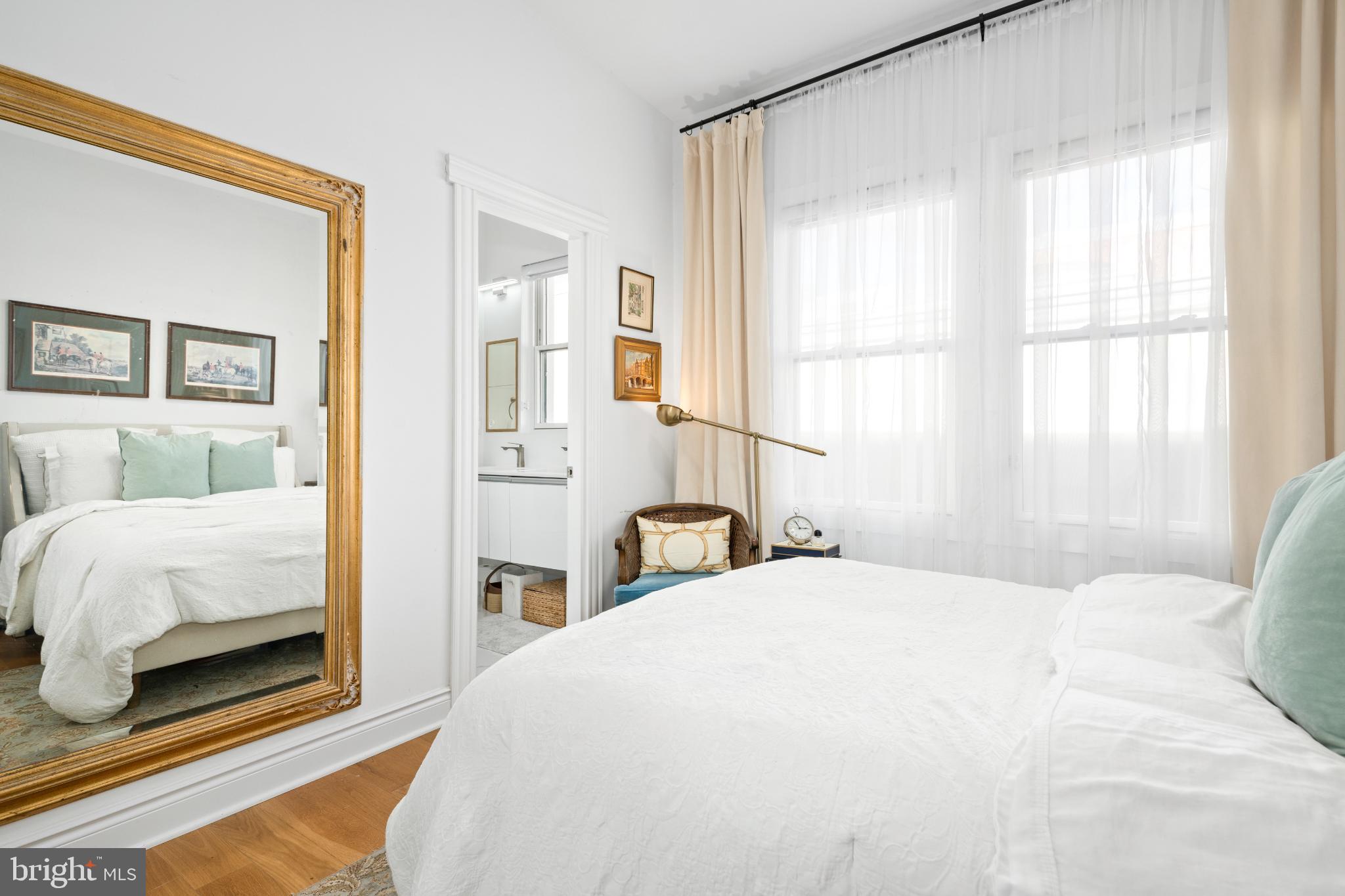 317 3rd Street Southeast, Unit 33 Washington, DC 20003 - Photo 22 of 26 a bedroom with a bed and a large window