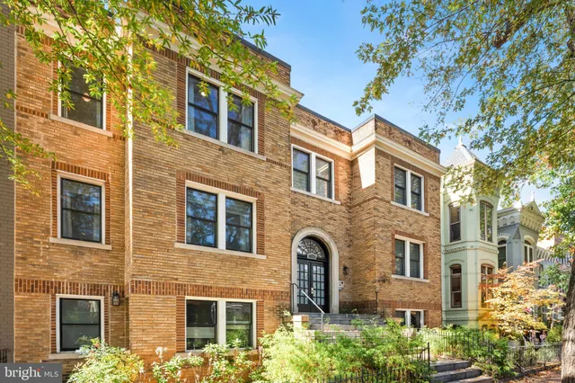 a front view of a multi story residential apartment building