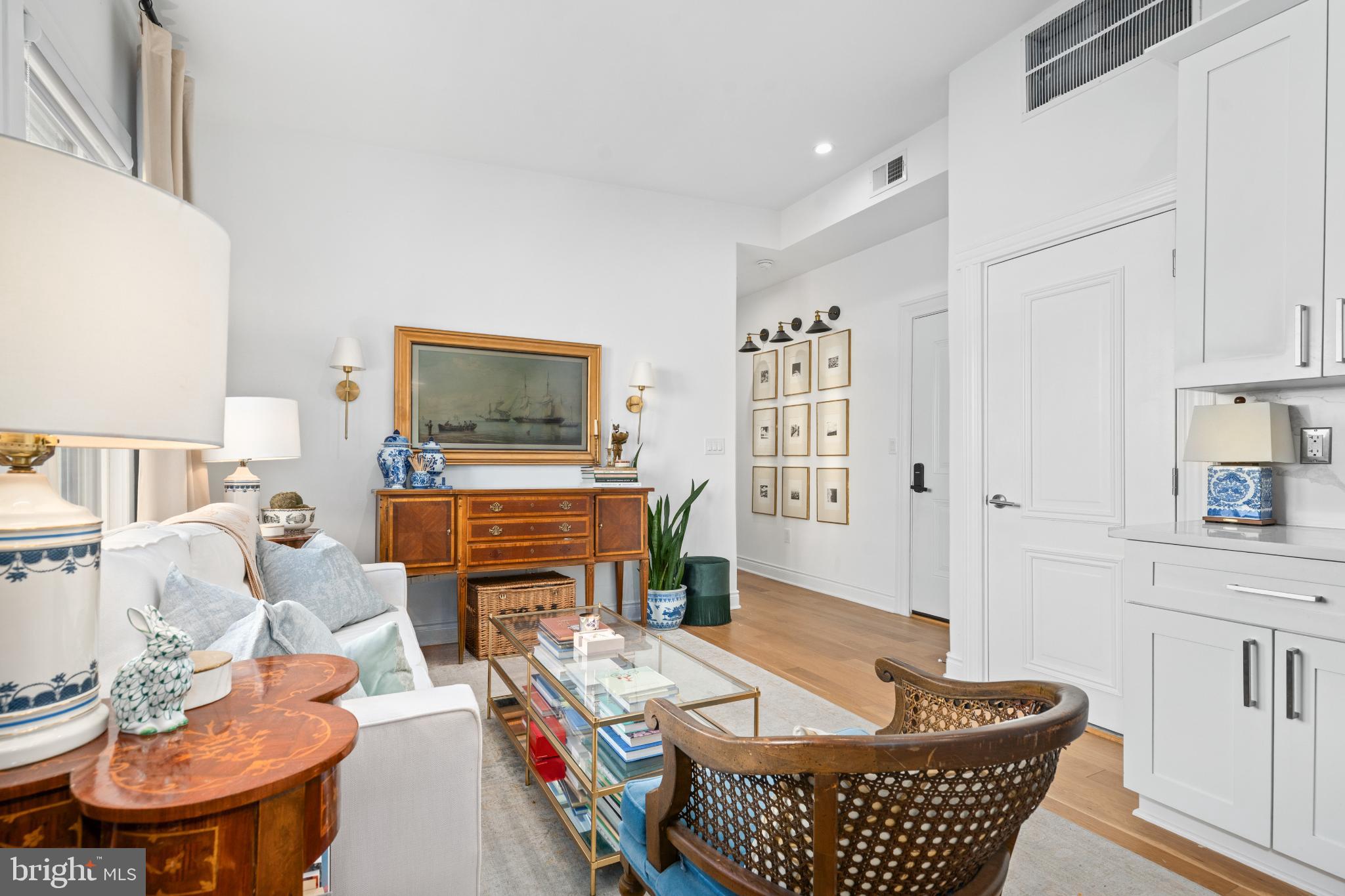 317 3rd Street Southeast, Unit 33 Washington, DC 20003 - Photo 7 of 26 a living room with furniture a fireplace and a flat screen tv