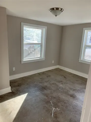 an empty room with windows