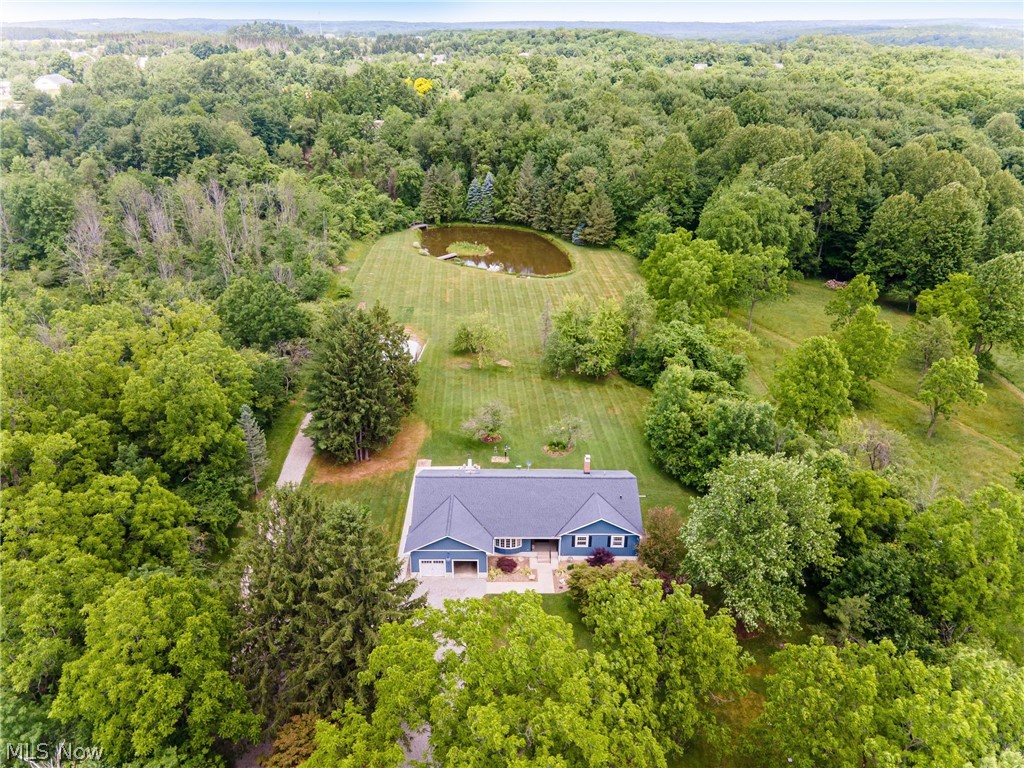 11292 Butternut Road Chardon, OH 44024 - Photo 2 of 49 Aerial perspective showcasing a single-story residence with a dark gray roof