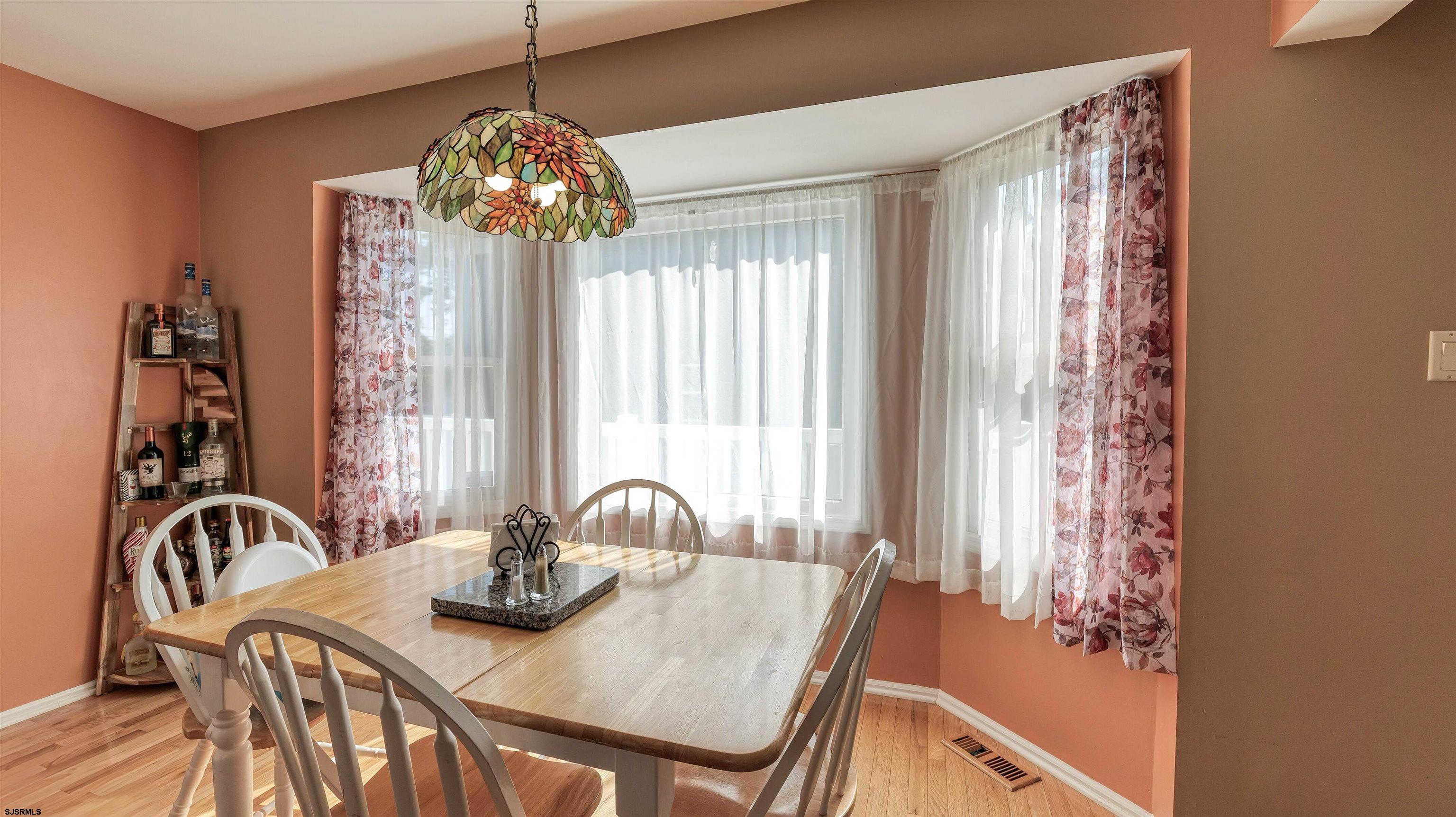 209 Reed Road Absecon, NJ 08201 - Photo 16 of 57 a view of a dining room with furniture and window