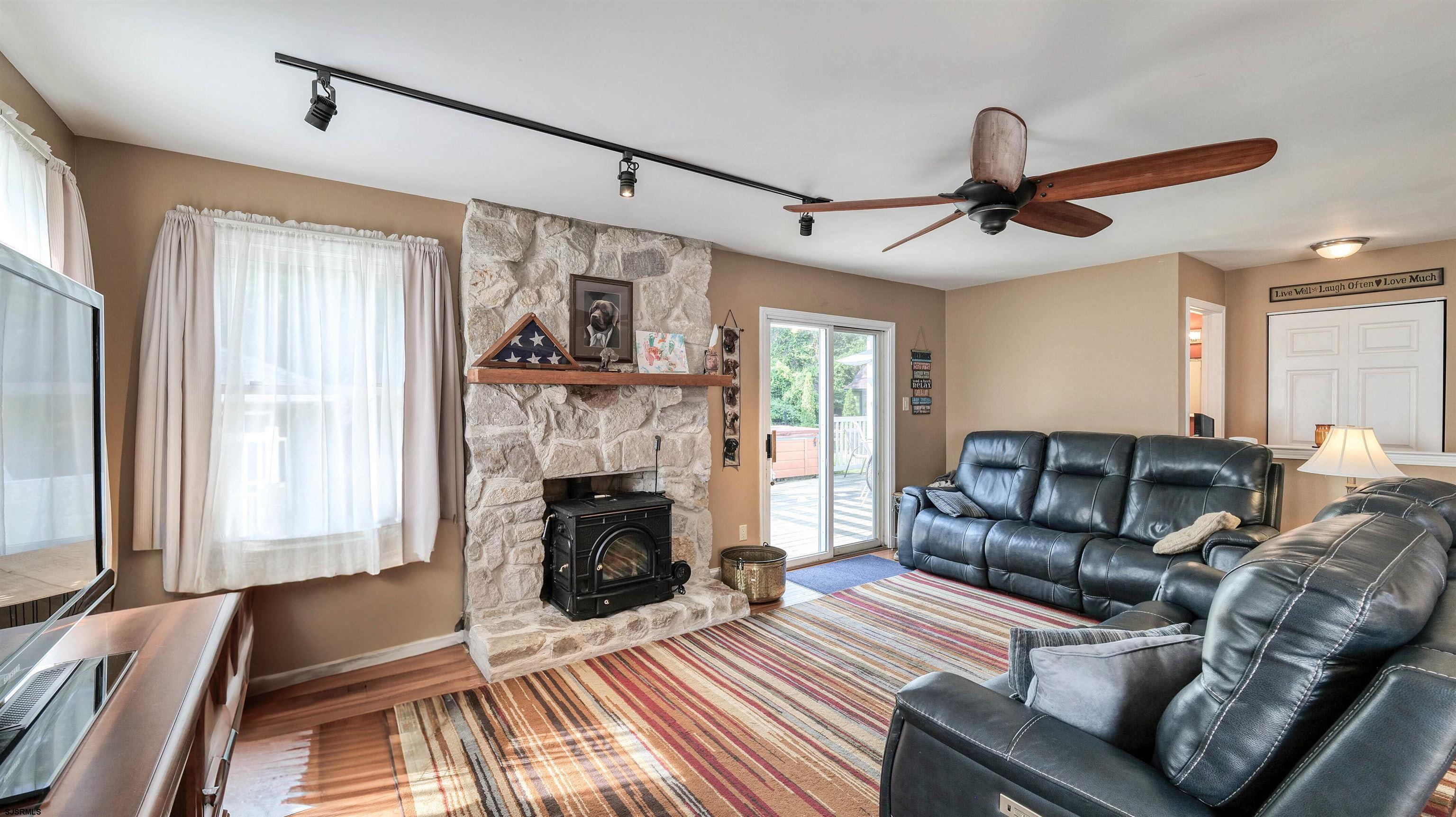 209 Reed Road Absecon, NJ 08201 - Photo 18 of 57 a living room with furniture and a fireplace