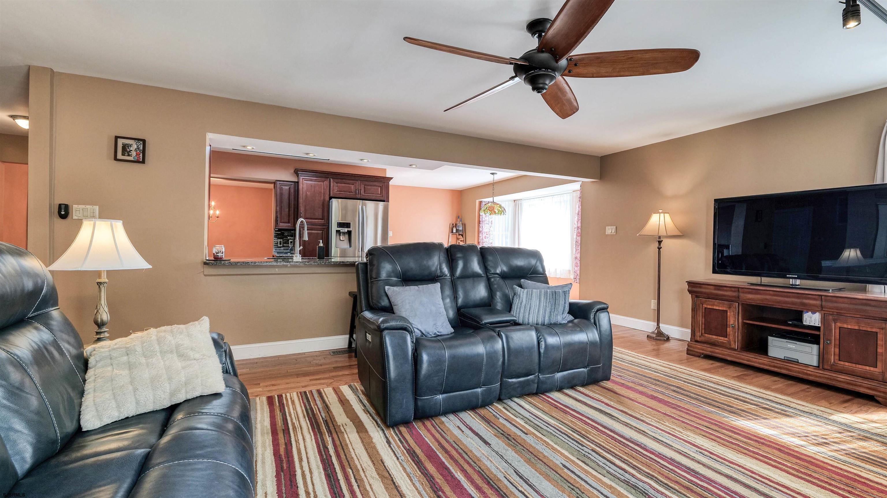 209 Reed Road Absecon, NJ 08201 - Photo 19 of 57 a living room with furniture and a flat screen tv