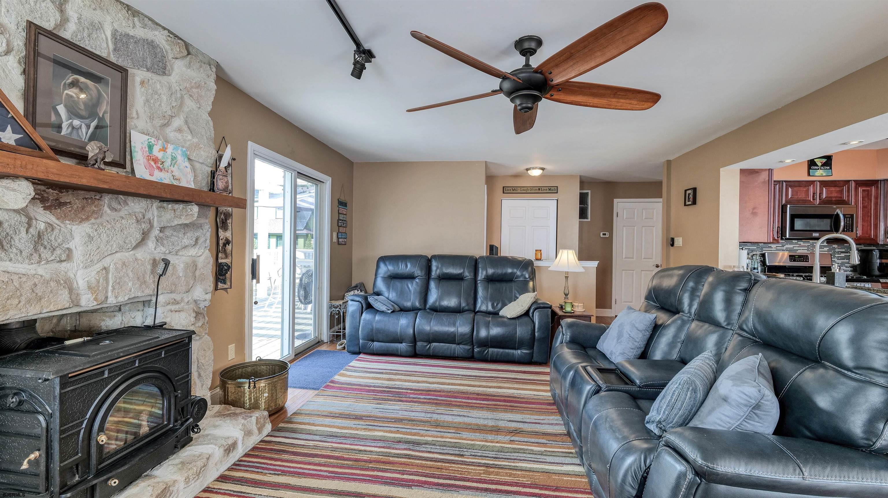 209 Reed Road Absecon, NJ 08201 - Photo 20 of 57 a living room with furniture and a fireplace