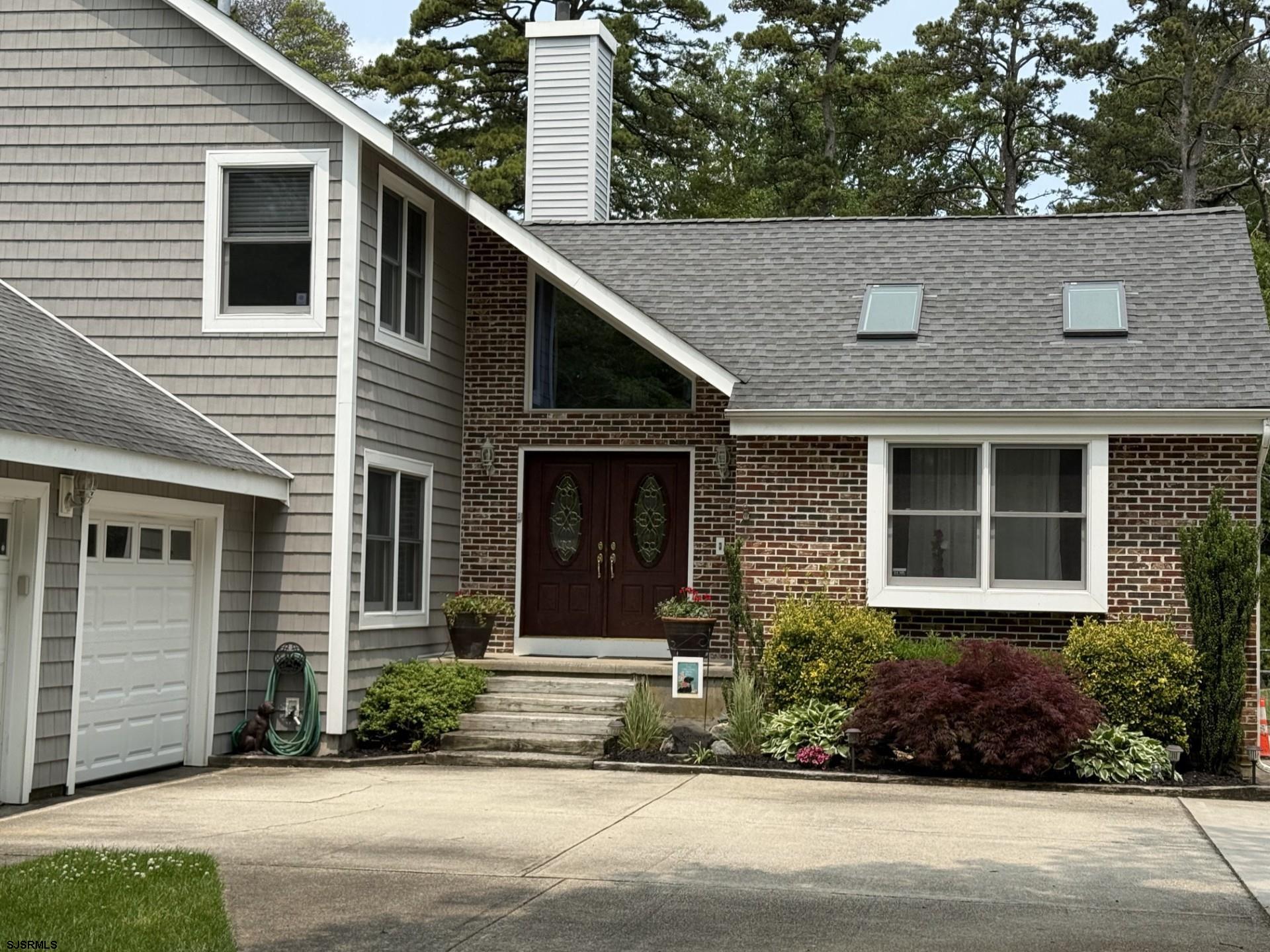 209 Reed Road Absecon, NJ 08201 - Photo 3 of 57 a front view of a house with a yard