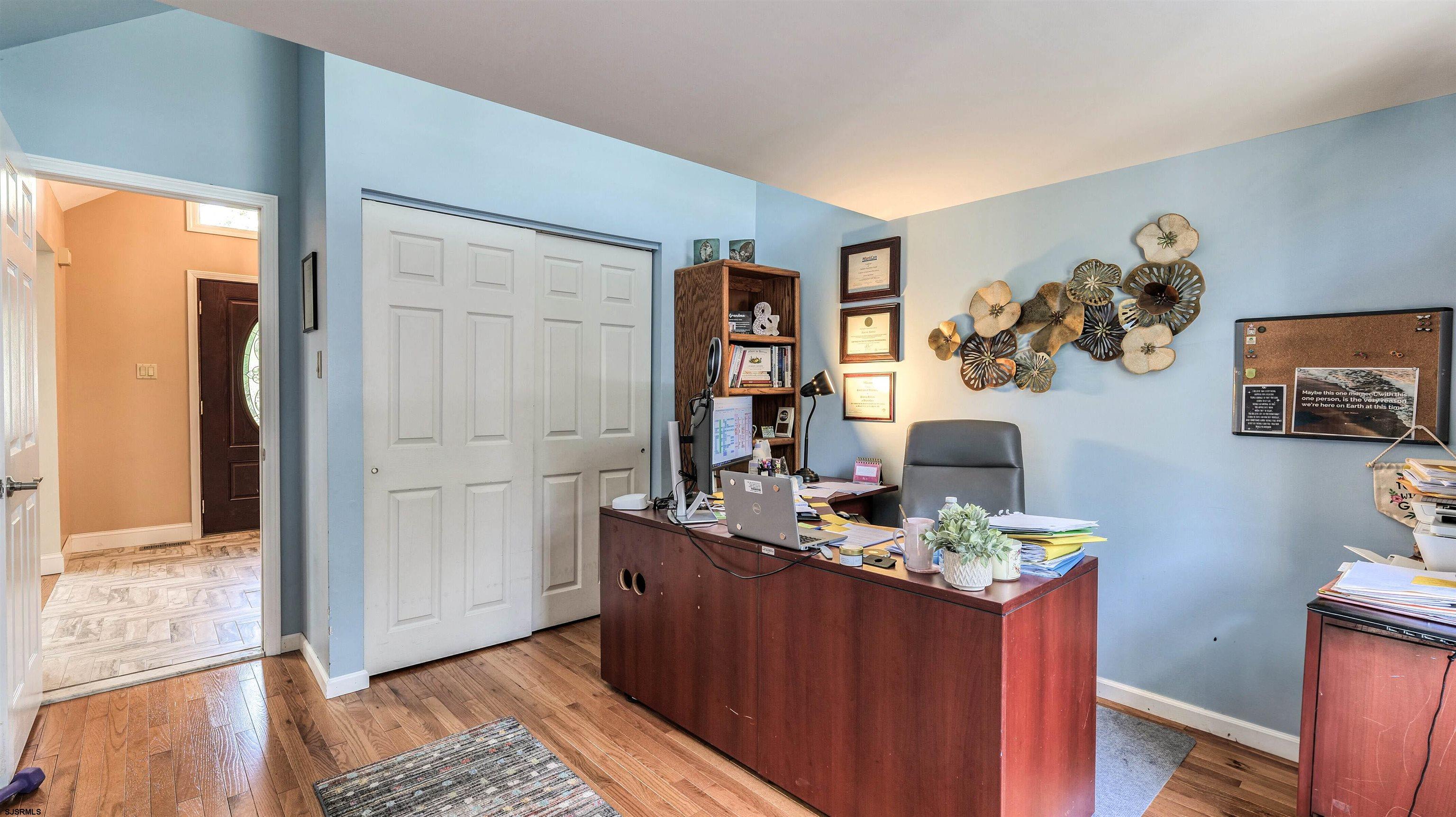 209 Reed Road Absecon, NJ 08201 - Photo 33 of 57 a room with a table and painting on the wall