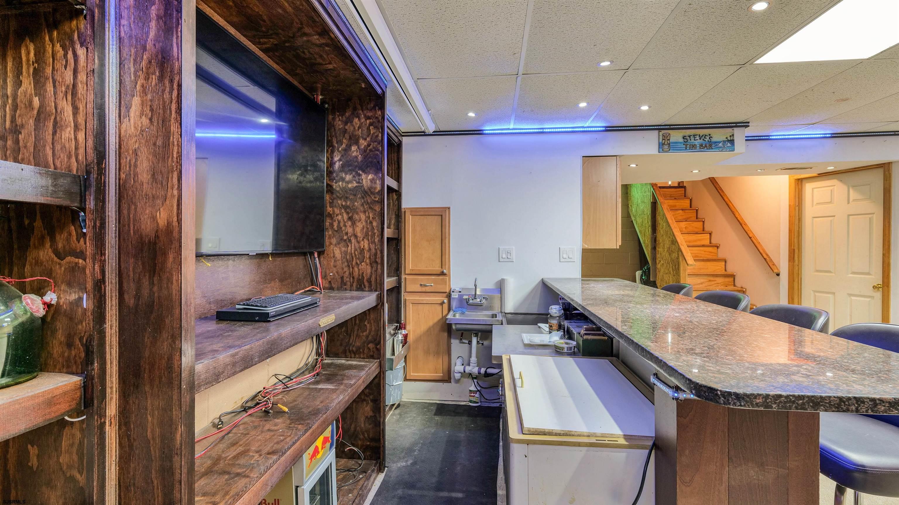209 Reed Road Absecon, NJ 08201 - Photo 36 of 57 a kitchen with stainless steel appliances granite countertop sink stove and cabinets