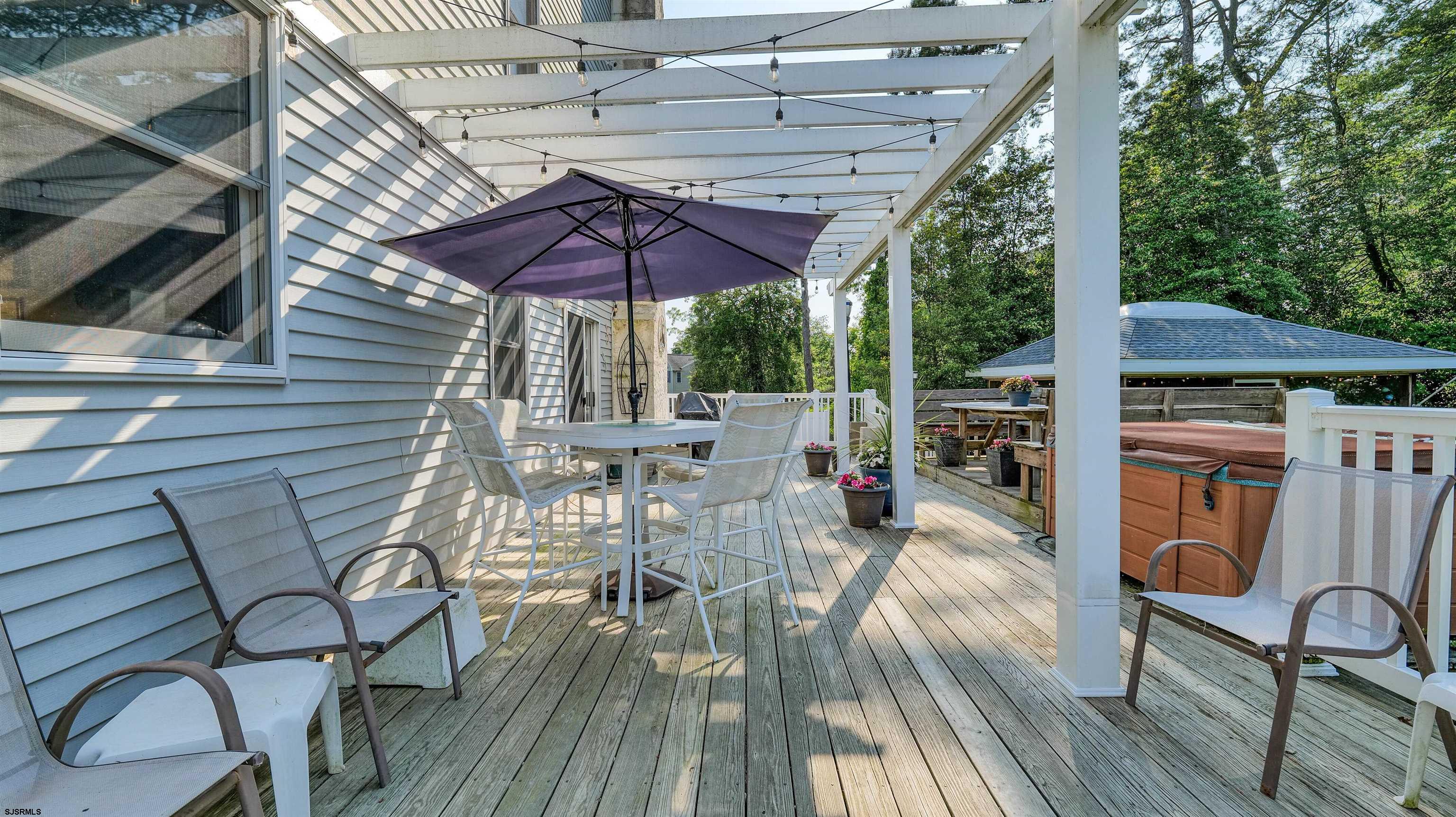 209 Reed Road Absecon, NJ 08201 - Photo 42 of 57 a view of a chairs and table in the patio