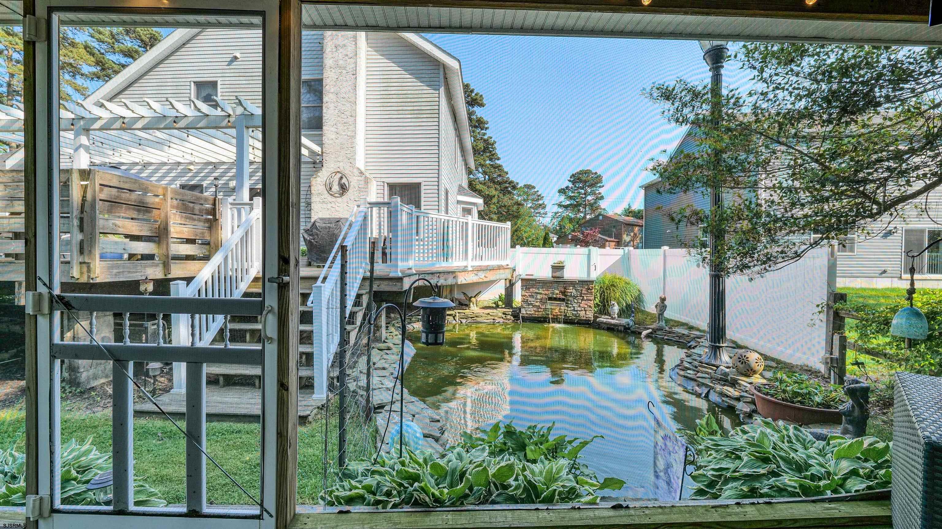 209 Reed Road Absecon, NJ 08201 - Photo 48 of 57 a view of swimming pool with outdoor seating and plants