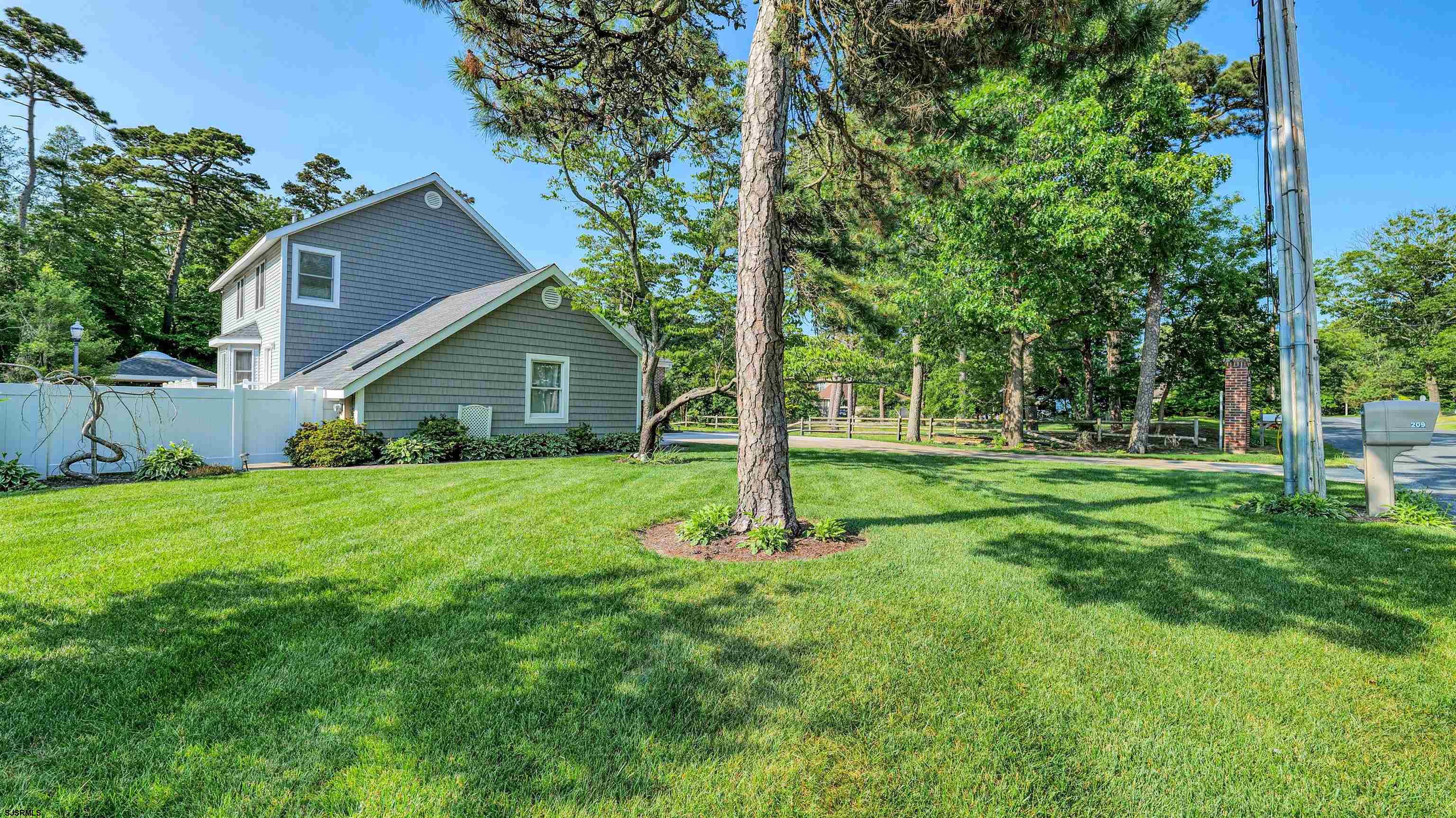 209 Reed Road Absecon, NJ 08201 - Photo 53 of 57 a view of a house with backyard and garden