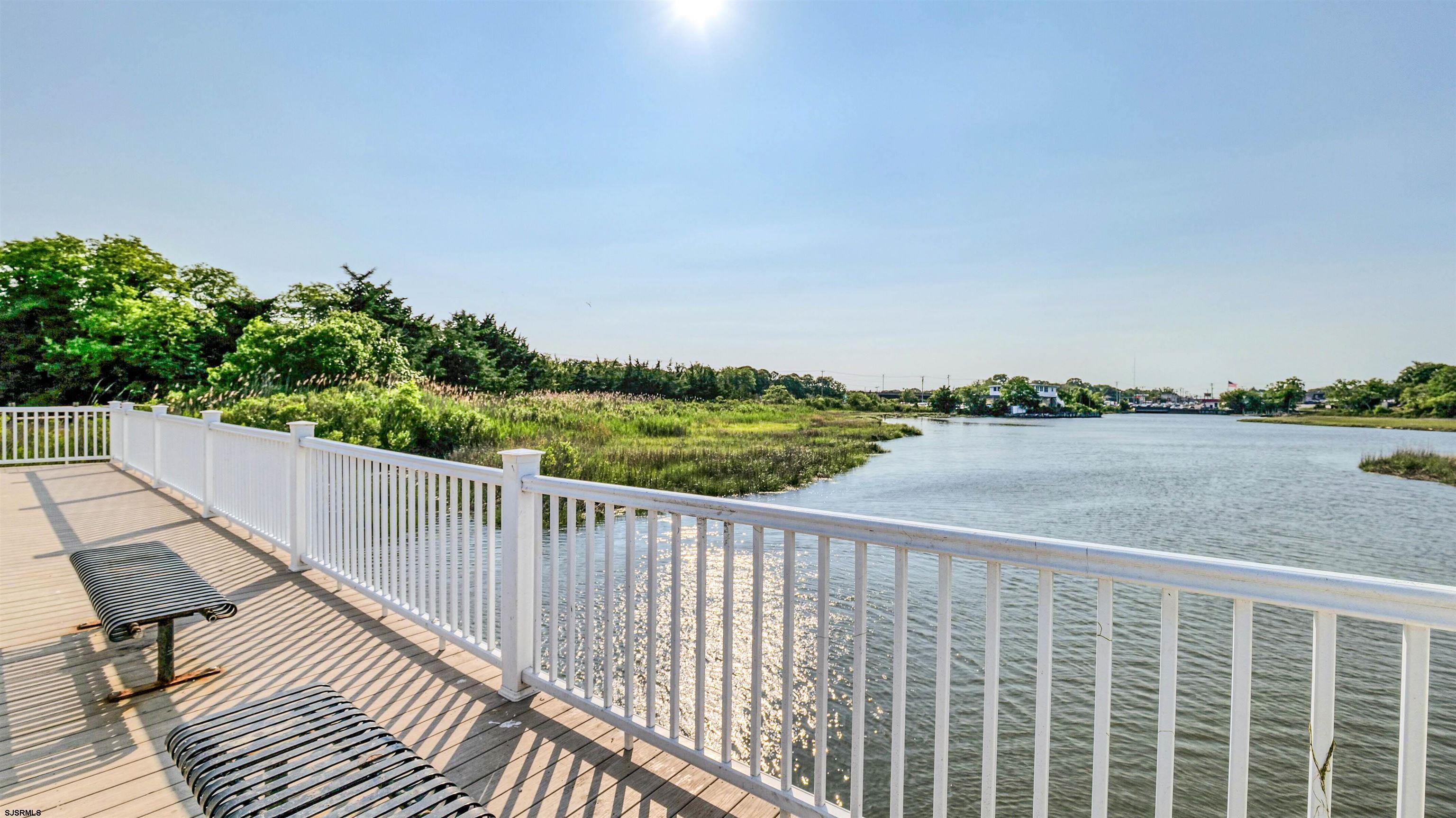209 Reed Road Absecon, NJ 08201 - Photo 57 of 57 a balcony with wooden floor and fence