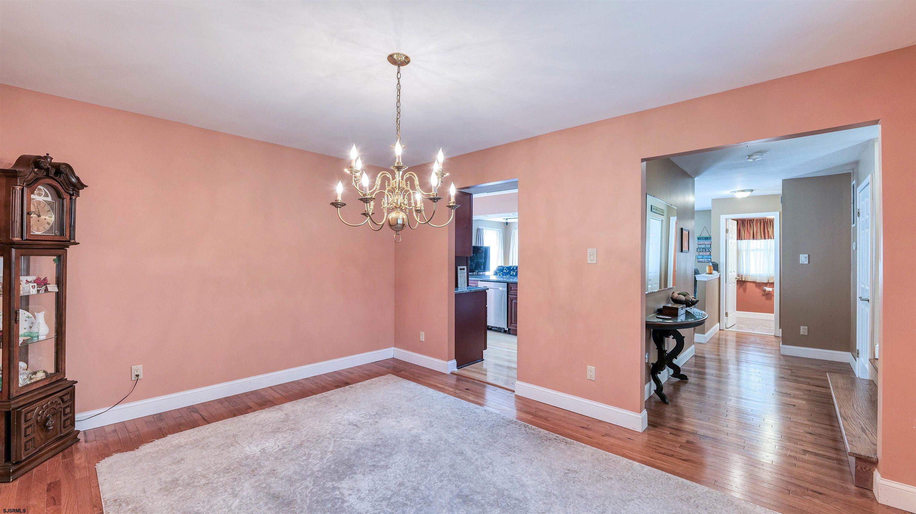 209 Reed Road Absecon, NJ 08201 - Photo 9 of 57 a view of a livingroom with a chandelier