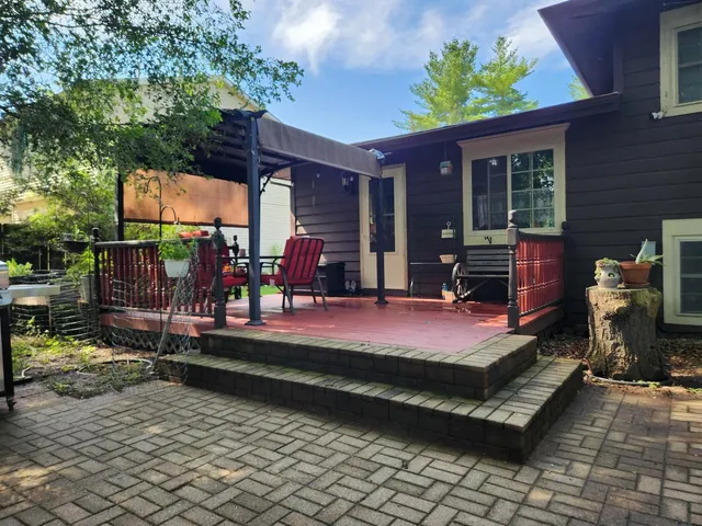 a view of a chair and tables in the garden