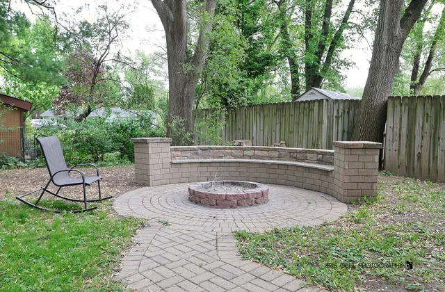 a front view of house with yard and trees