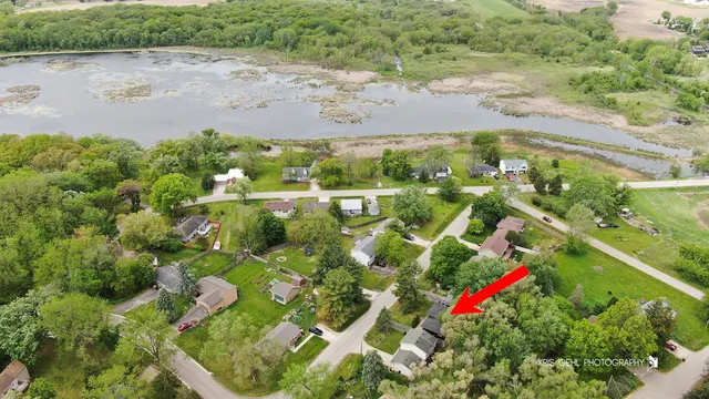 a view of a city with lush green forest
