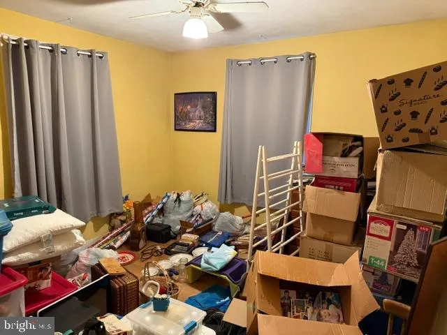 a living room with furniture a window and a fireplace