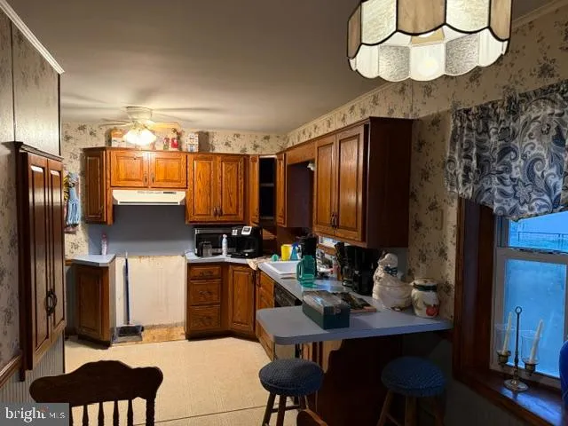 a kitchen with a sink cabinets and appliances
