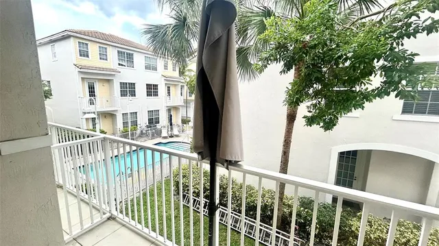 a view of a balcony with a pot