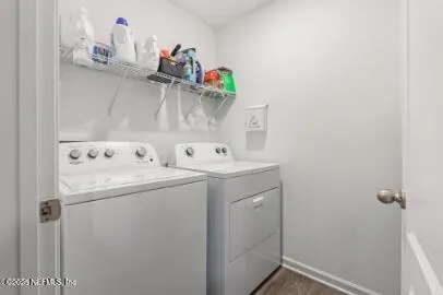 a view of a house with a yard and lake view