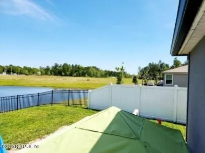 a view of a house with a big yard