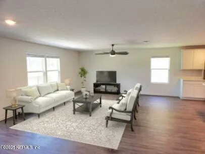 a living room with furniture and a large window