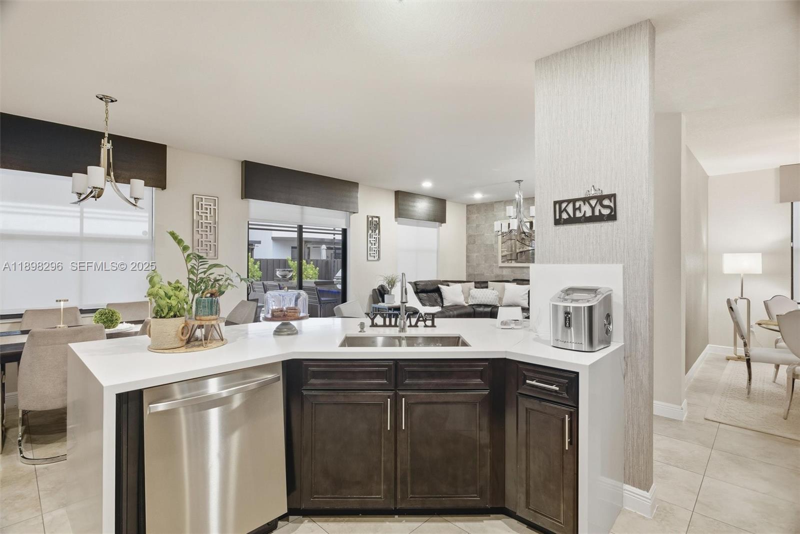 8870 Northwest 99th Path Doral, FL 33178 - Photo 12 of 44 a kitchen with a sink and cabinets