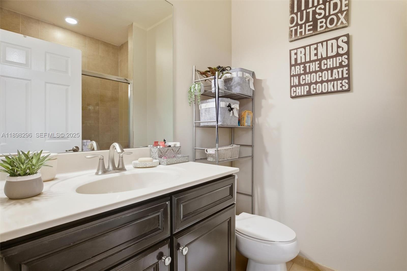 8870 Northwest 99th Path Doral, FL 33178 - Photo 17 of 44 a bathroom with a sink a toilet and mirror