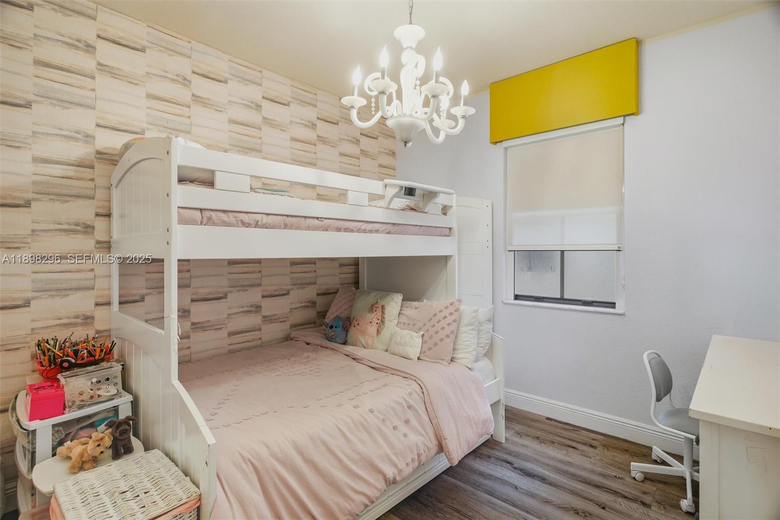 8870 Northwest 99th Path Doral, FL 33178 - Photo 21 of 44 a bedroom with a bed and a chandelier