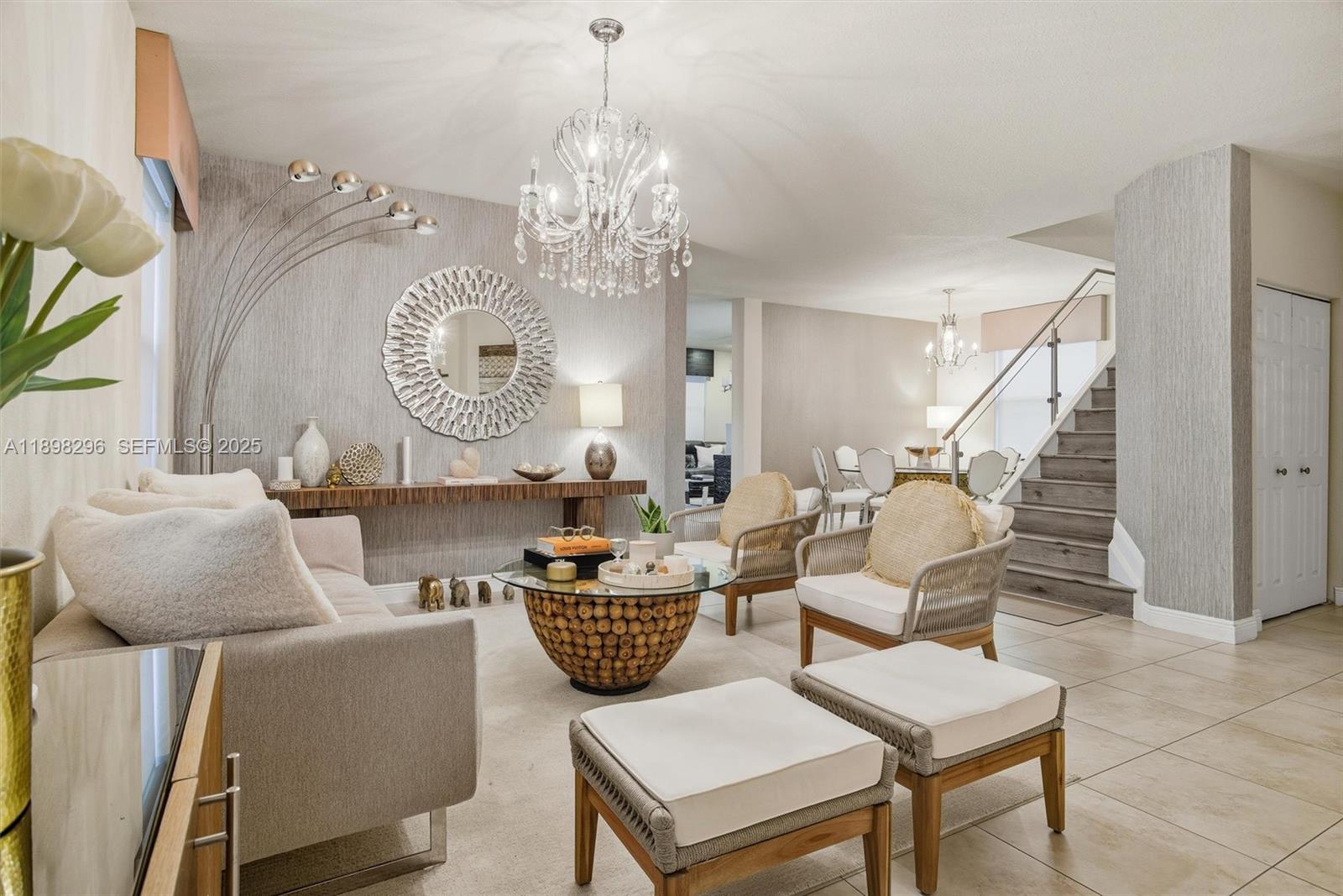 8870 Northwest 99th Path Doral, FL 33178 - Photo 5 of 44 a living room with furniture a chandelier and a chandelier