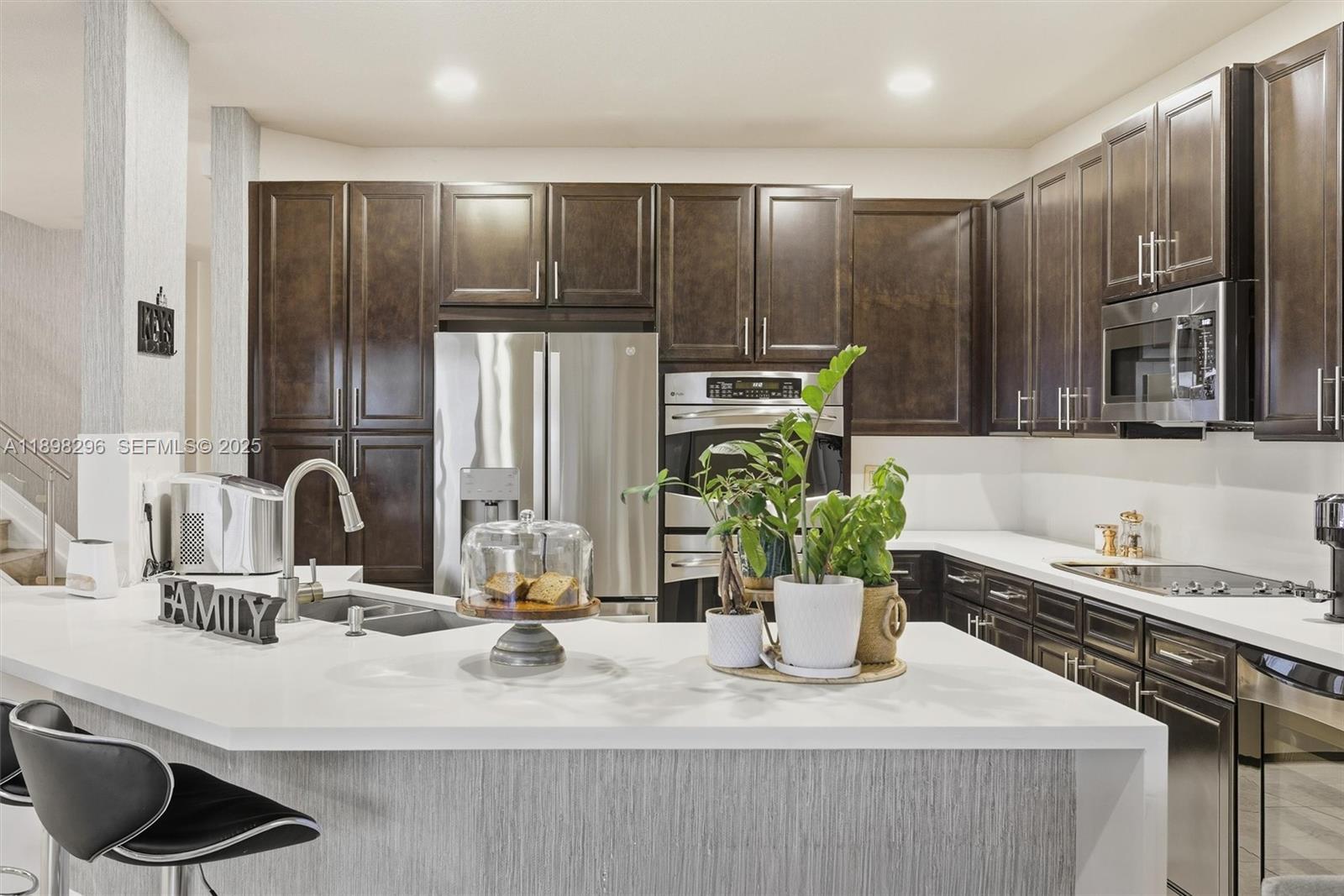 8870 Northwest 99th Path Doral, FL 33178 - Photo 10 of 44 a kitchen with a refrigerator and a sink