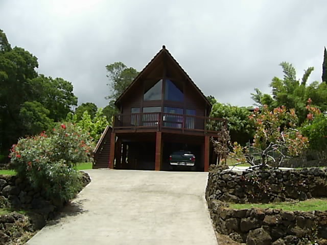 4615 Lower Kula Road Kula, HI 96790 - Photo 1 of 20 a front view of a house with a yard and garage
