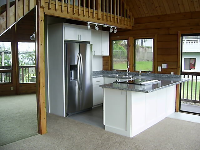 4615 Lower Kula Road Kula, HI 96790 - Photo 7 of 20 a kitchen with stainless steel appliances granite countertop a refrigerator a sink and a stove