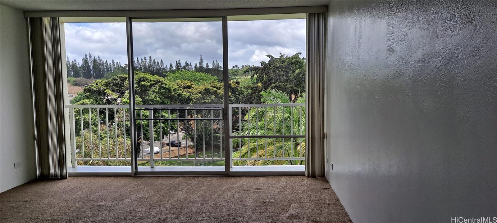 98-410 Koauka Loop, Unit 7C Aiea, HI 96701 - Photo 1 of 1 a view of a garden with an outdoor space
