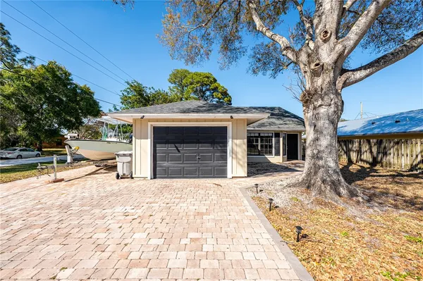 a view of a house with a snow on the road