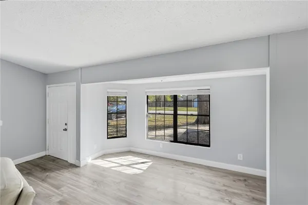 an empty room with windows