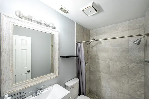 a bathroom with a sink and a toilet