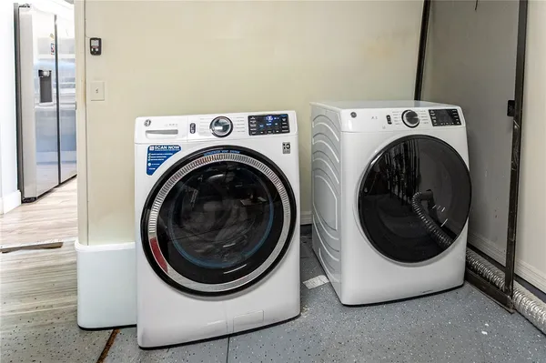 a utility room with dryer and washer