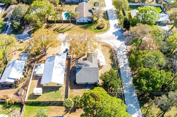 a view of house with a yard