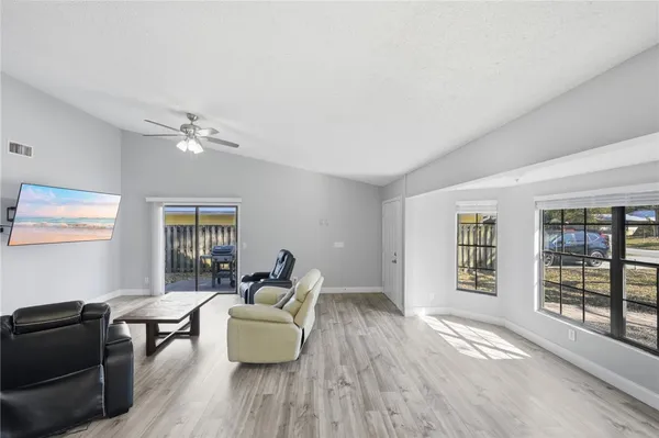 a living room with furniture and windows