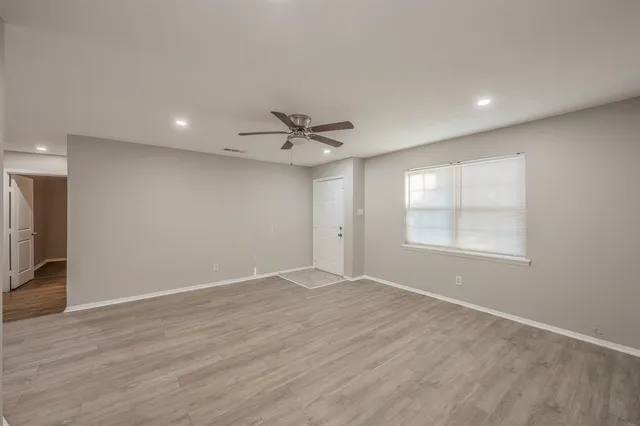 a view of an empty room with a window