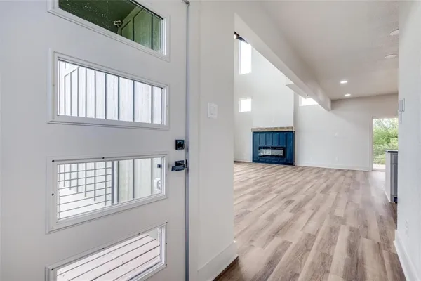 a view of kitchen and kitchen with furniture wooden floor and window