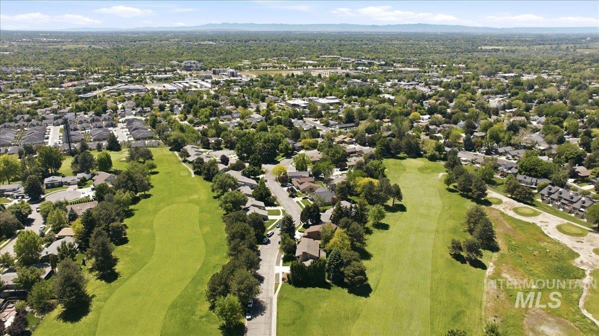 599 Pebble Beach Way Eagle, ID 83616 - Photo 39 of 44 Expansive aerial captures a residential community bordering a golf course with mature trees and manicured fairways