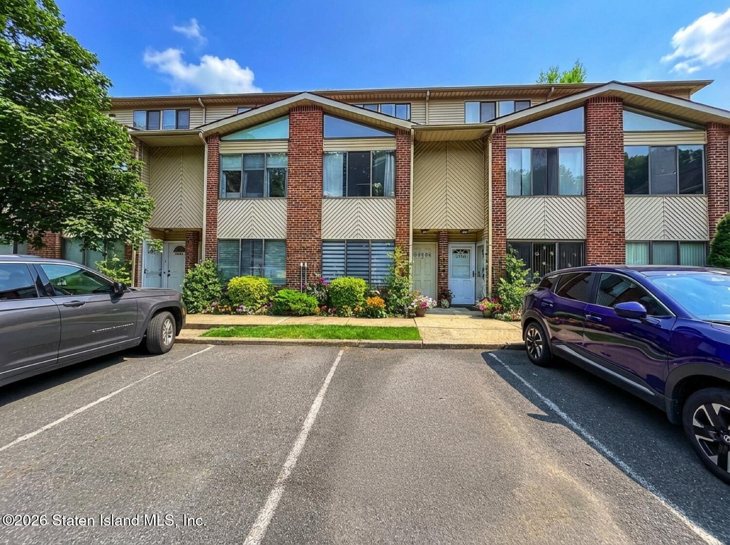 a view of a car park in front of a house