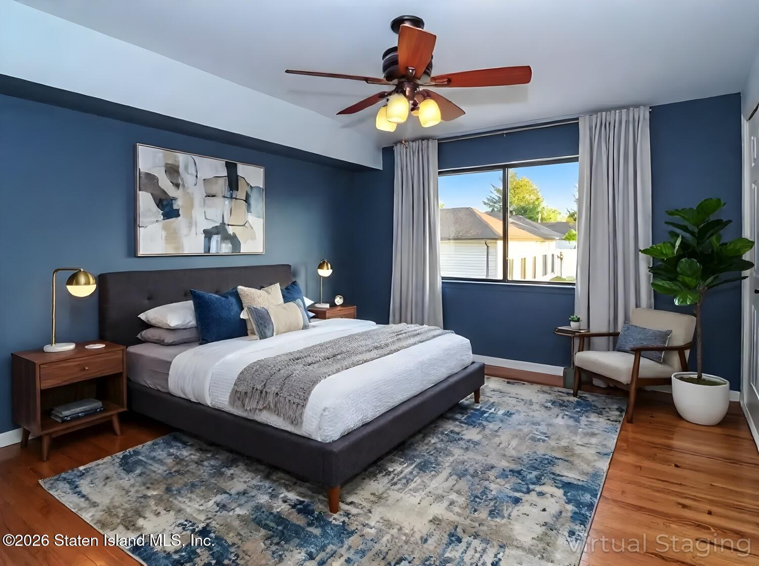 3438 A Amboy Road Staten Island, NY 10306 - Photo 14 of 21 a bedroom with a bed and a chandelier