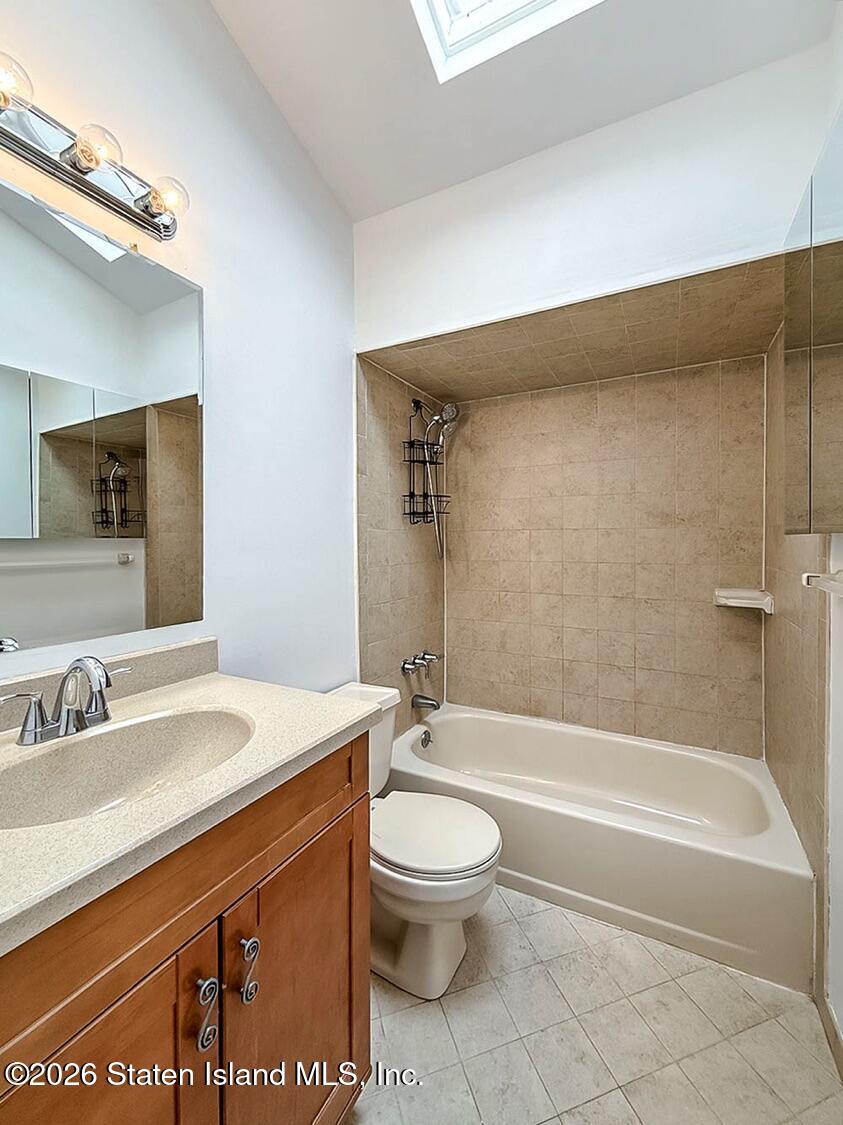 3438 A Amboy Road Staten Island, NY 10306 - Photo 15 of 21 a bathroom with a sink a toilet and a bathtub