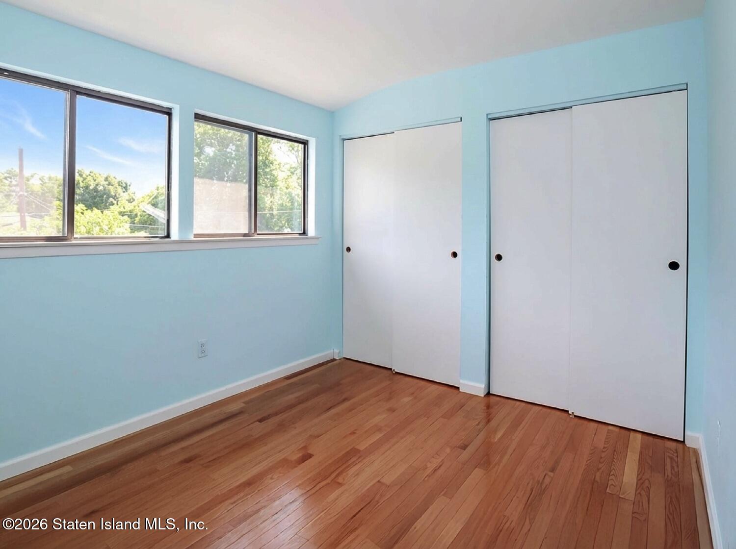 3438 A Amboy Road Staten Island, NY 10306 - Photo 16 of 21 a view of empty room with wooden floor and fan