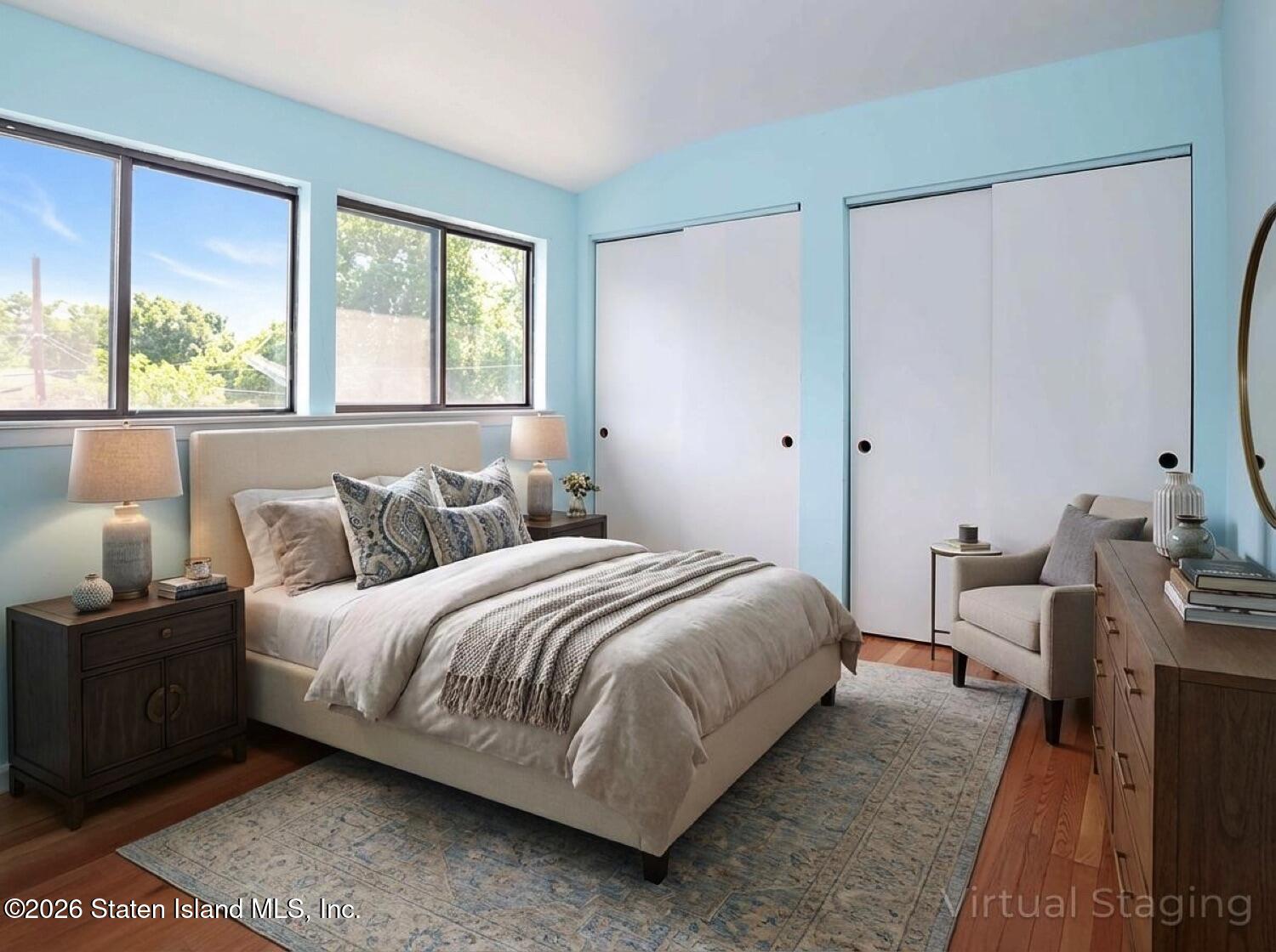 3438 A Amboy Road Staten Island, NY 10306 - Photo 17 of 21 a bedroom with a bed and a large window