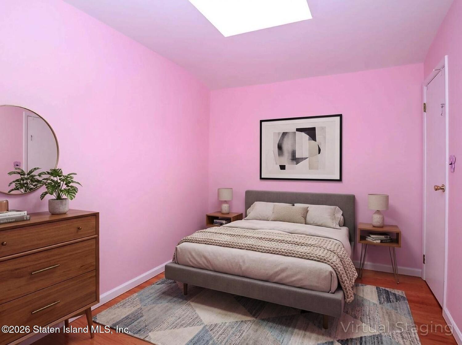 3438 A Amboy Road Staten Island, NY 10306 - Photo 19 of 21 a bedroom with a bed and a potted plant on dresser